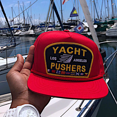 The red "Yacht Pusher" snapback by Feelgood Threads
